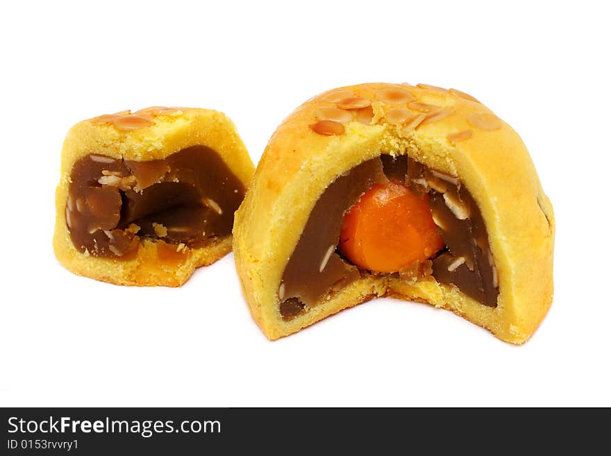 A sliced Shanghai moon cake with yolk in the center.