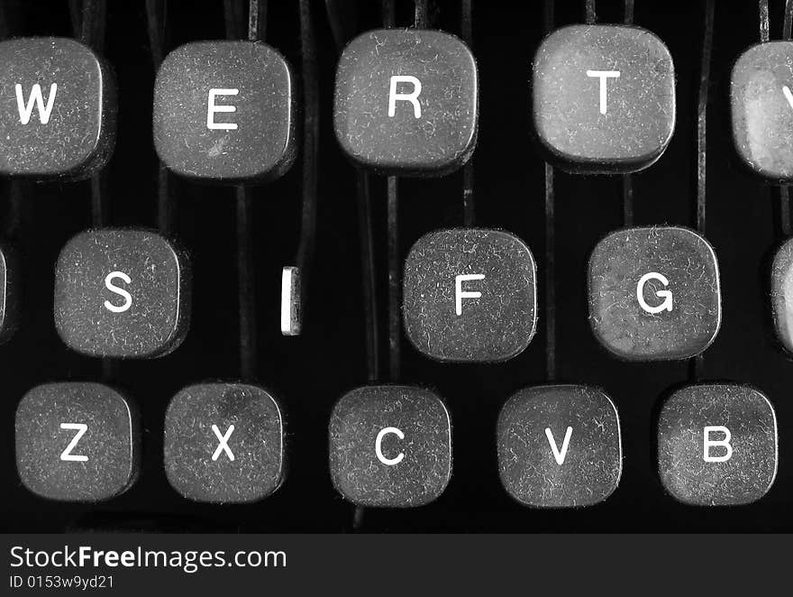 Old dusty typewriter keytops with missing key. Old dusty typewriter keytops with missing key