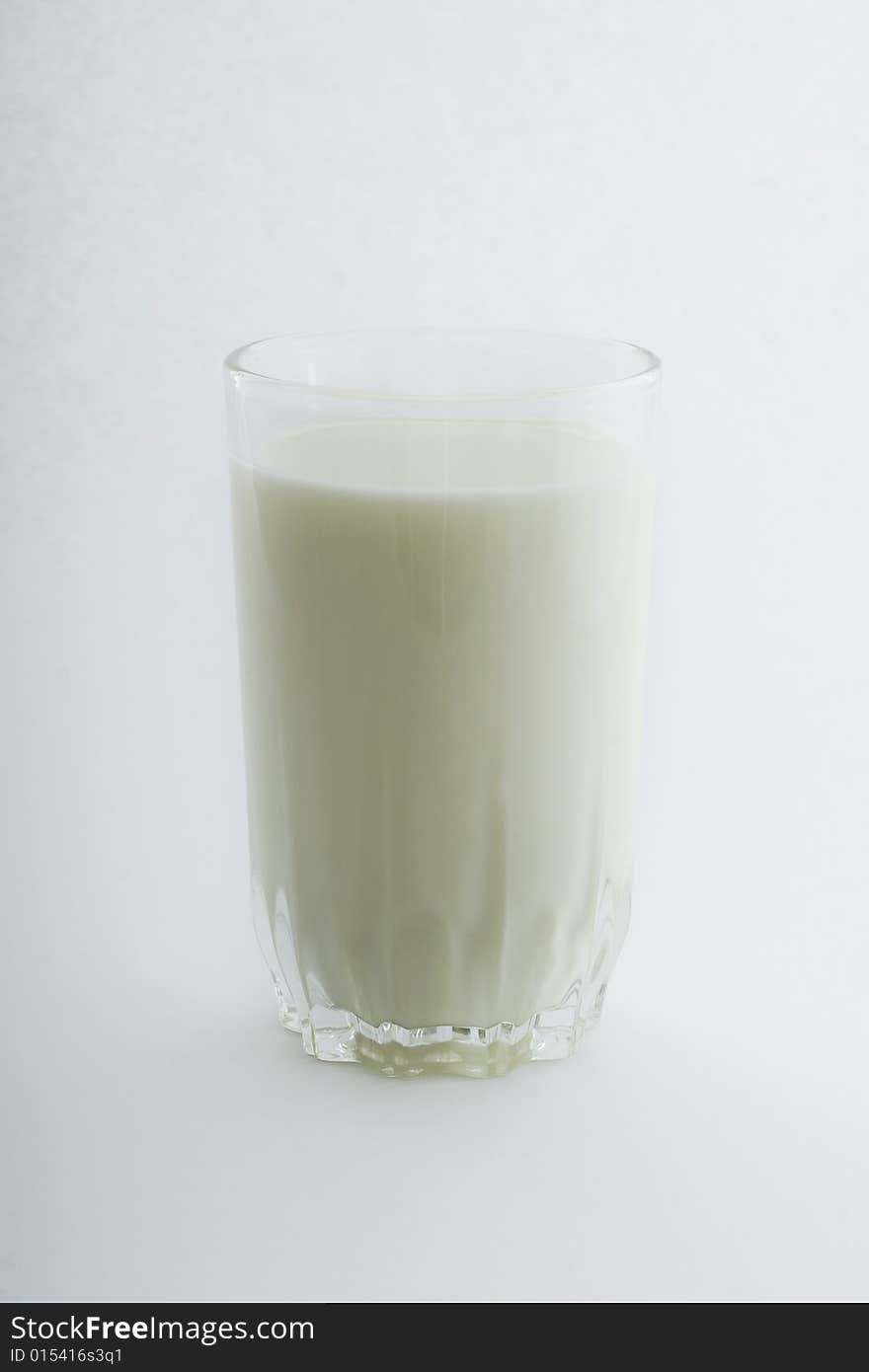 Glass of milk close-up isolated on white background