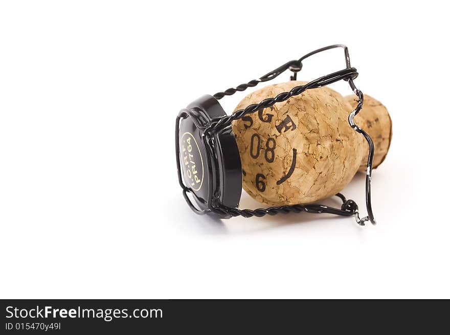 Sparkling wine cork with metal cage isolated on white background. Sparkling wine cork with metal cage isolated on white background