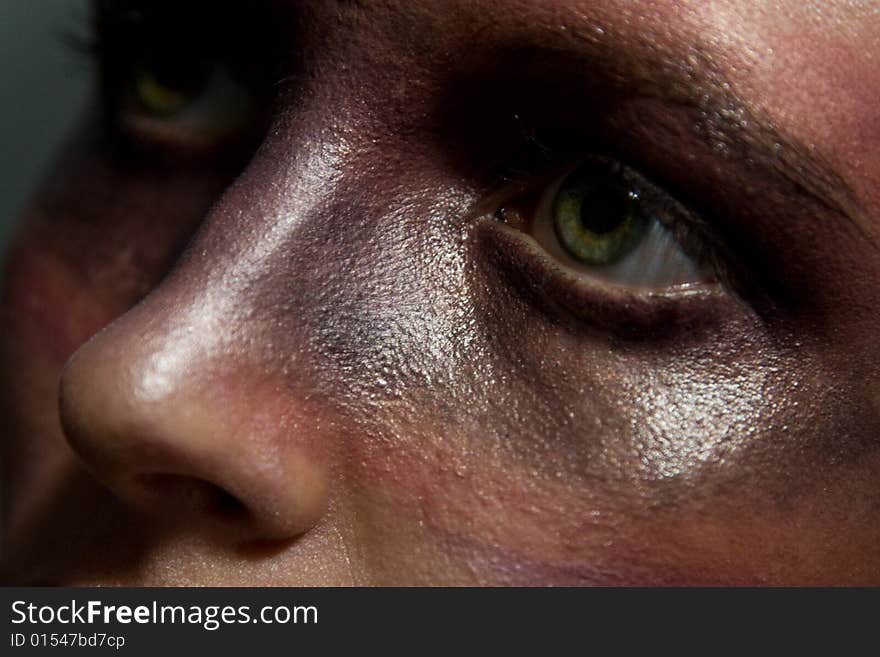 Studio portrait of a young  woman with aggressive make-up