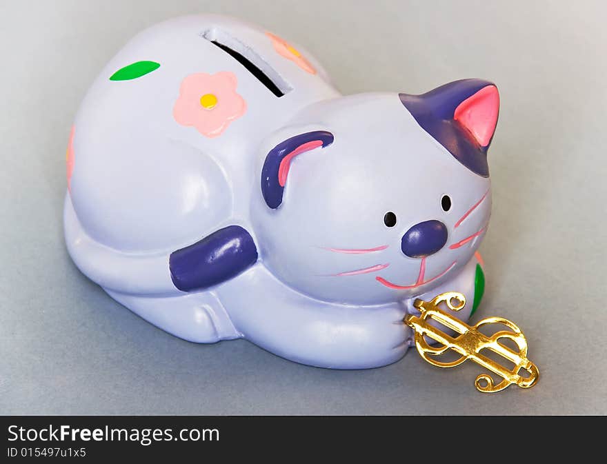 Blue cat - moneybox with golden dollar sign. Blue cat - moneybox with golden dollar sign