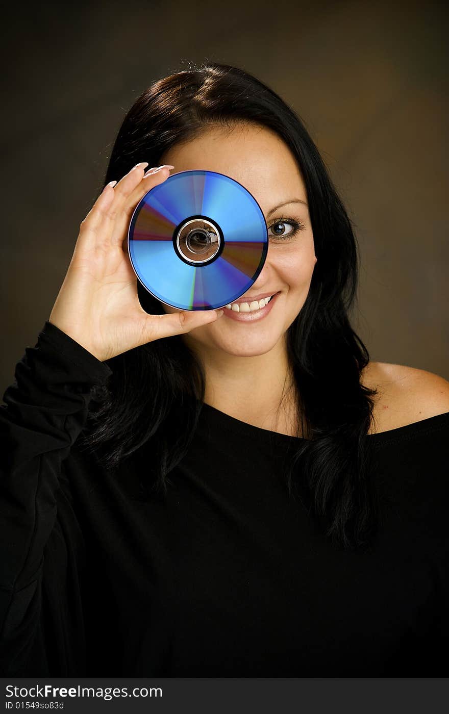 Girl with DVD  disk in the studio