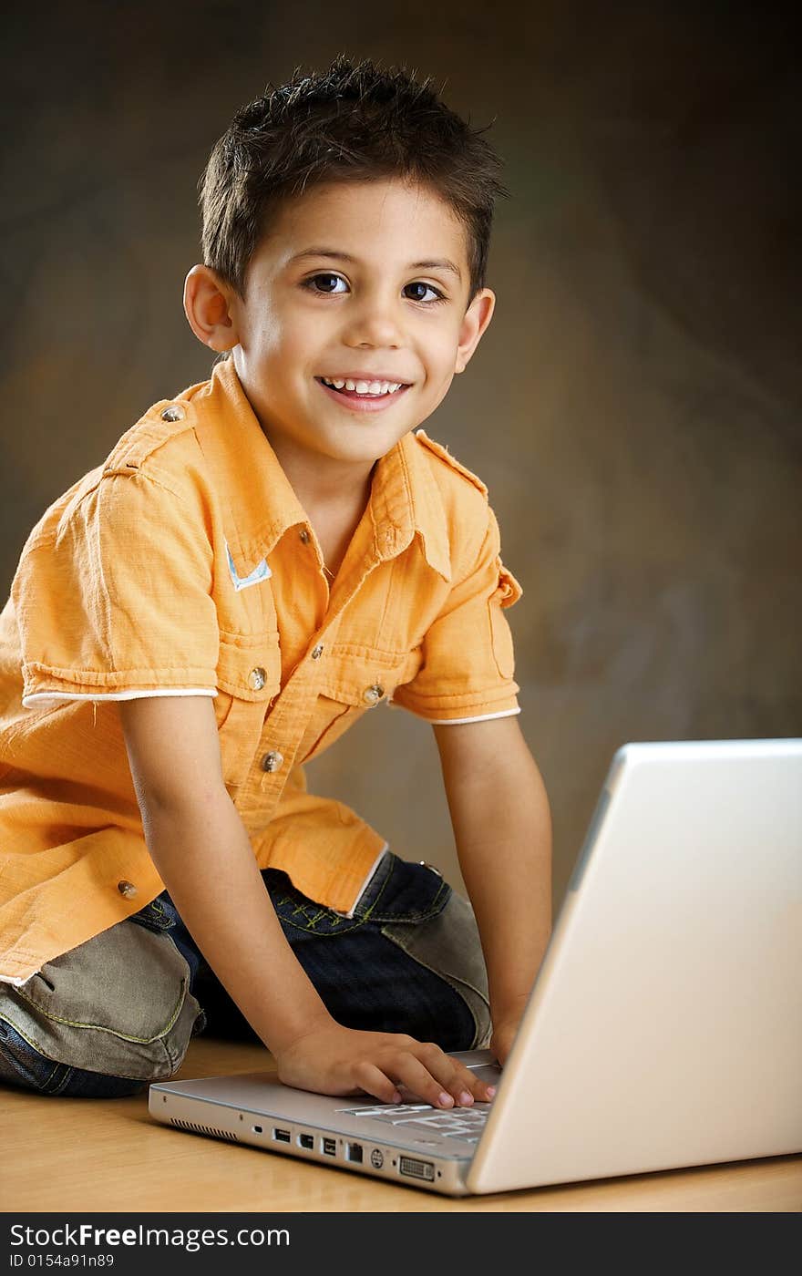 Boy works with the computer. Boy works with the computer