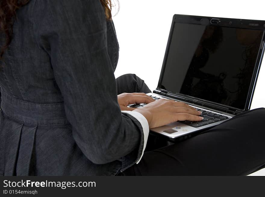 Fingers on keyboard of laptop