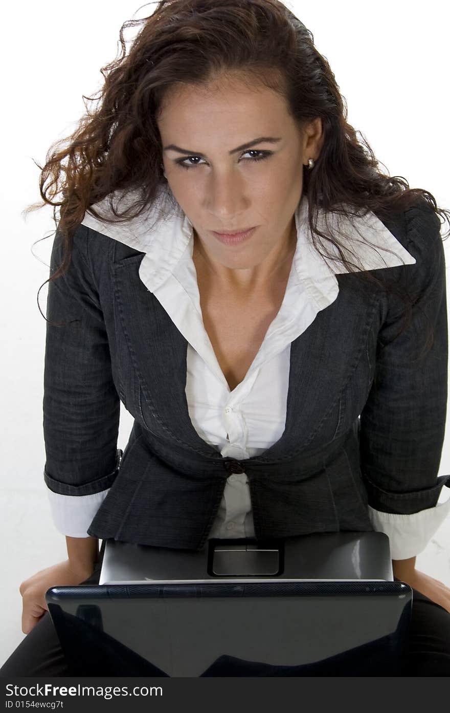 Lady looking upward while working on laptop  on an isolated background