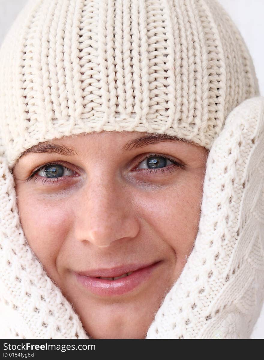 Young woman wearing winter cap and gloves. Autumnal portrait. Young woman wearing winter cap and gloves. Autumnal portrait.