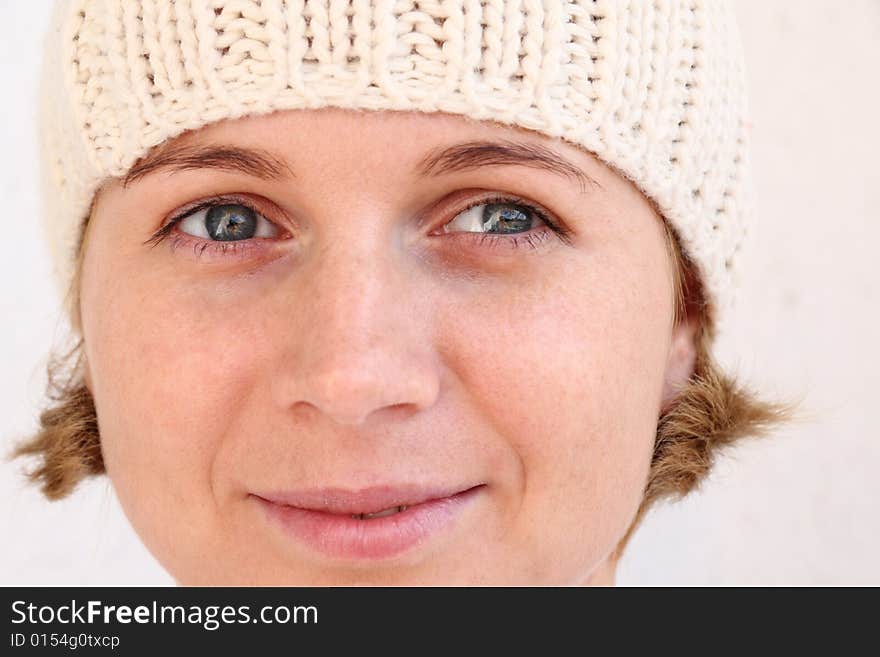 Young woman wearing winter cap. Autumnal portrait. Young woman wearing winter cap. Autumnal portrait.