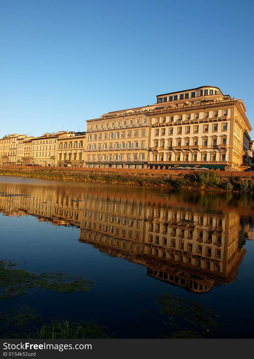 A wonderful shot of some buildings reflected in the waters of Arno river. A wonderful shot of some buildings reflected in the waters of Arno river