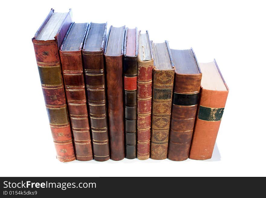 A row of antique leather books isolated on a white background