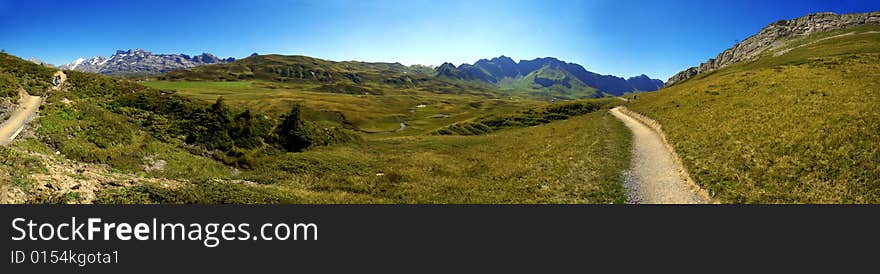 Hiking path in swiss mountains. Panorama view. Hiking path in swiss mountains. Panorama view.