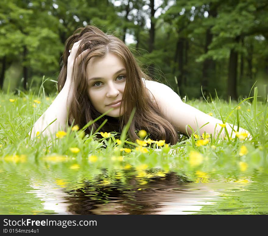 Young Woman On The Green Grass. Young Woman On The Green Grass