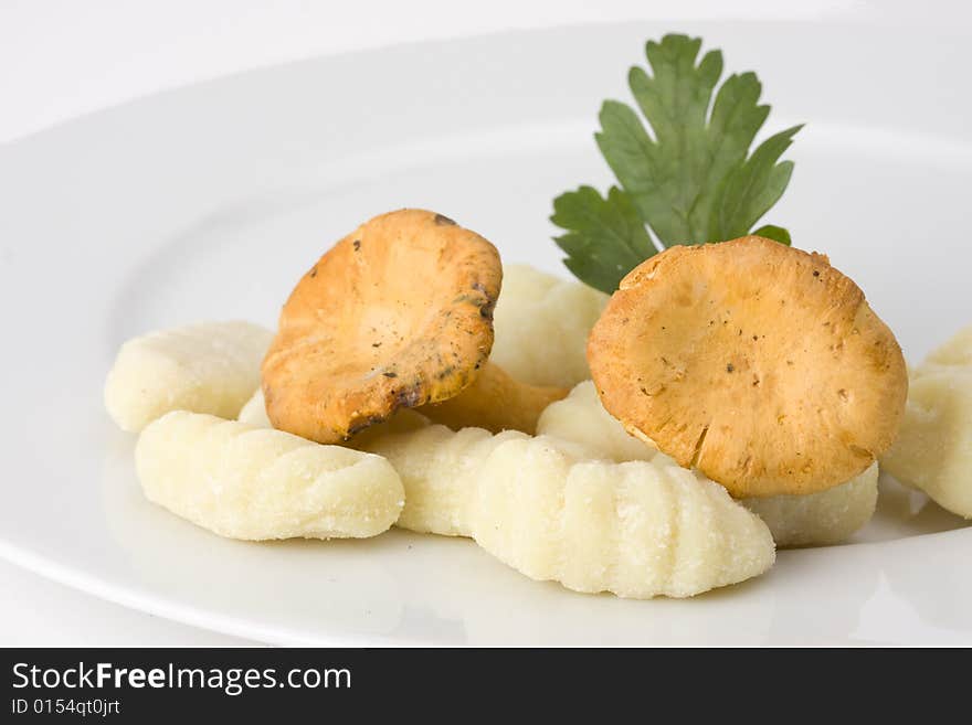 Uncooked gnocchi noodles on a plate