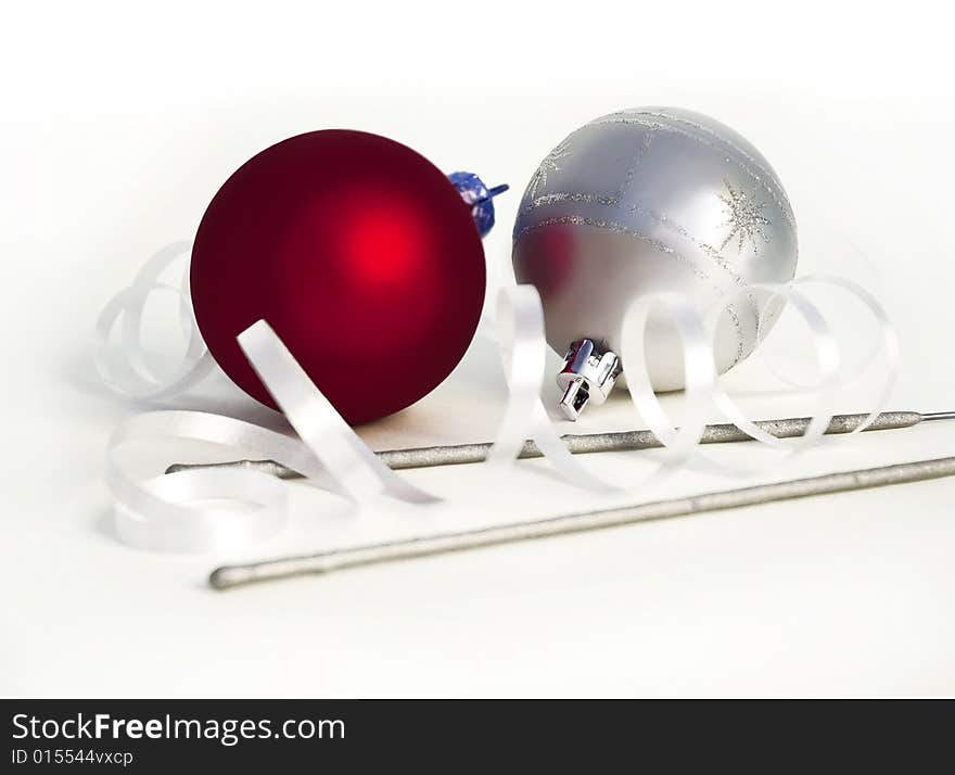 Christmas spheres and sparks on a white background