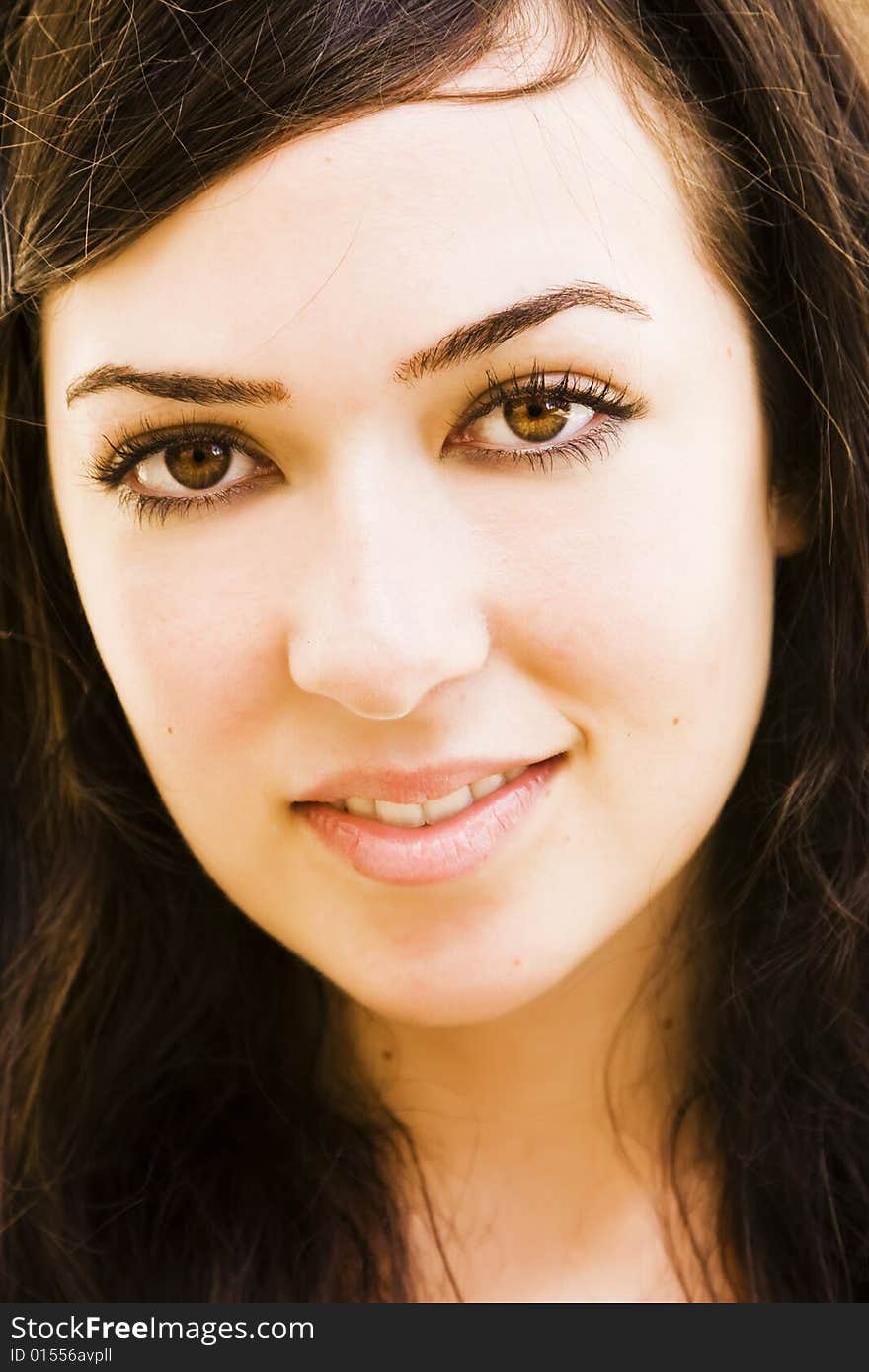 Green eyed beauty smiling at camera.