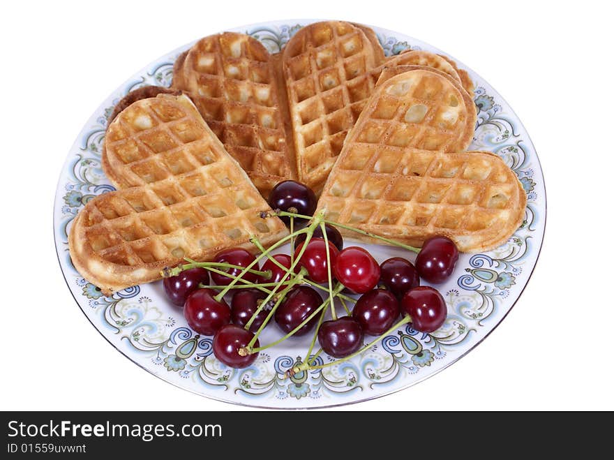 Baked waffles with cherry isolated on white background. Baked waffles with cherry isolated on white background