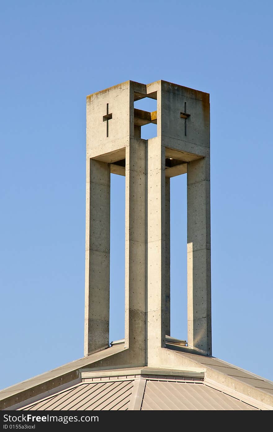 Modern church tower against blue sky - architectural details