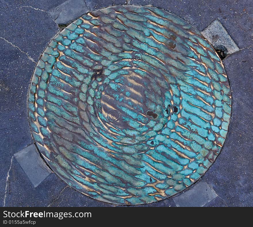 Grunge pavement with water hatchway