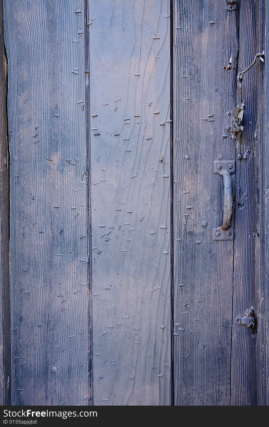 Rustic wooden door with metal handle