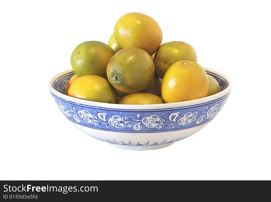 Ceramic bowl filled with oranges isolated with clipping path. Ceramic bowl filled with oranges isolated with clipping path