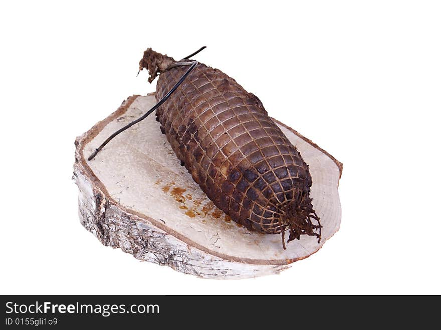 Ham lying on birch stump isolated on white background. Ham lying on birch stump isolated on white background