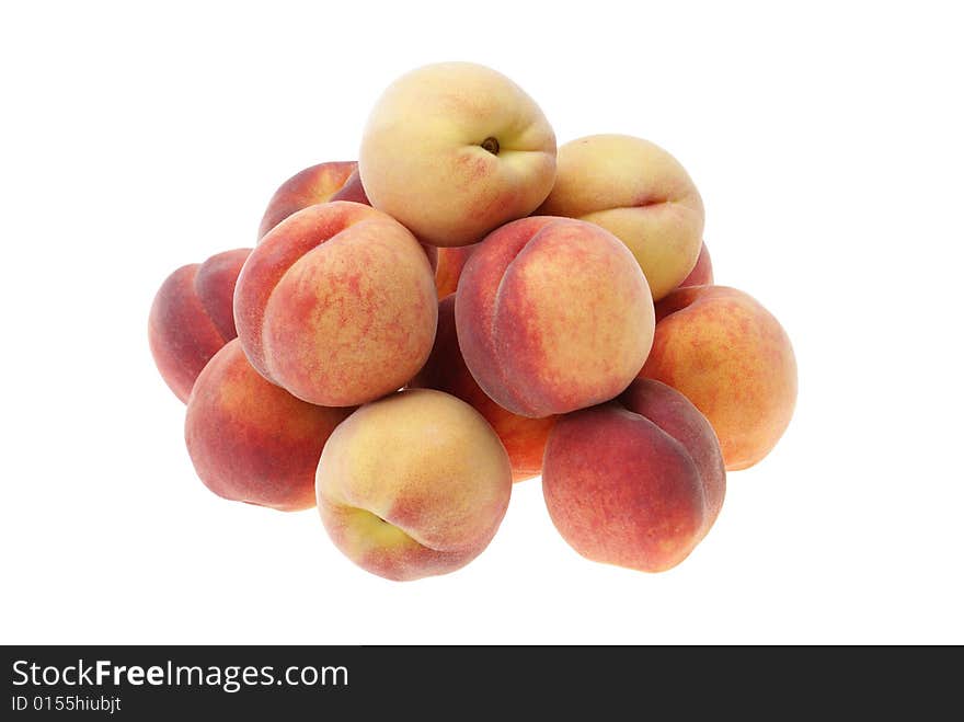 Ripe peaches arranged in heap isolated on white background