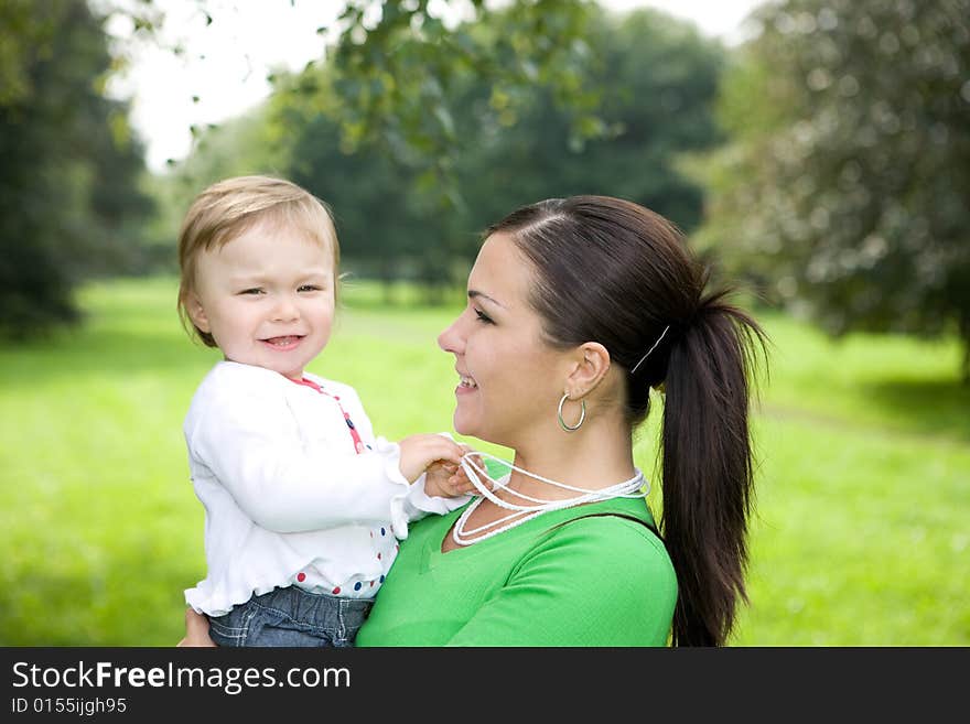 Happy family together in park. Happy family together in park