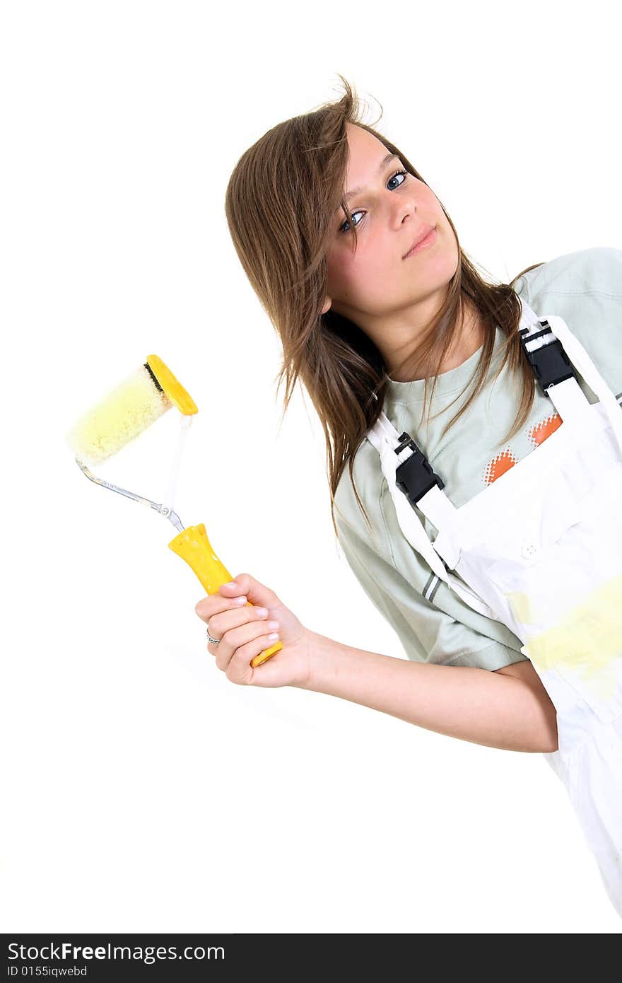 Pretty female holding a paint roller on white