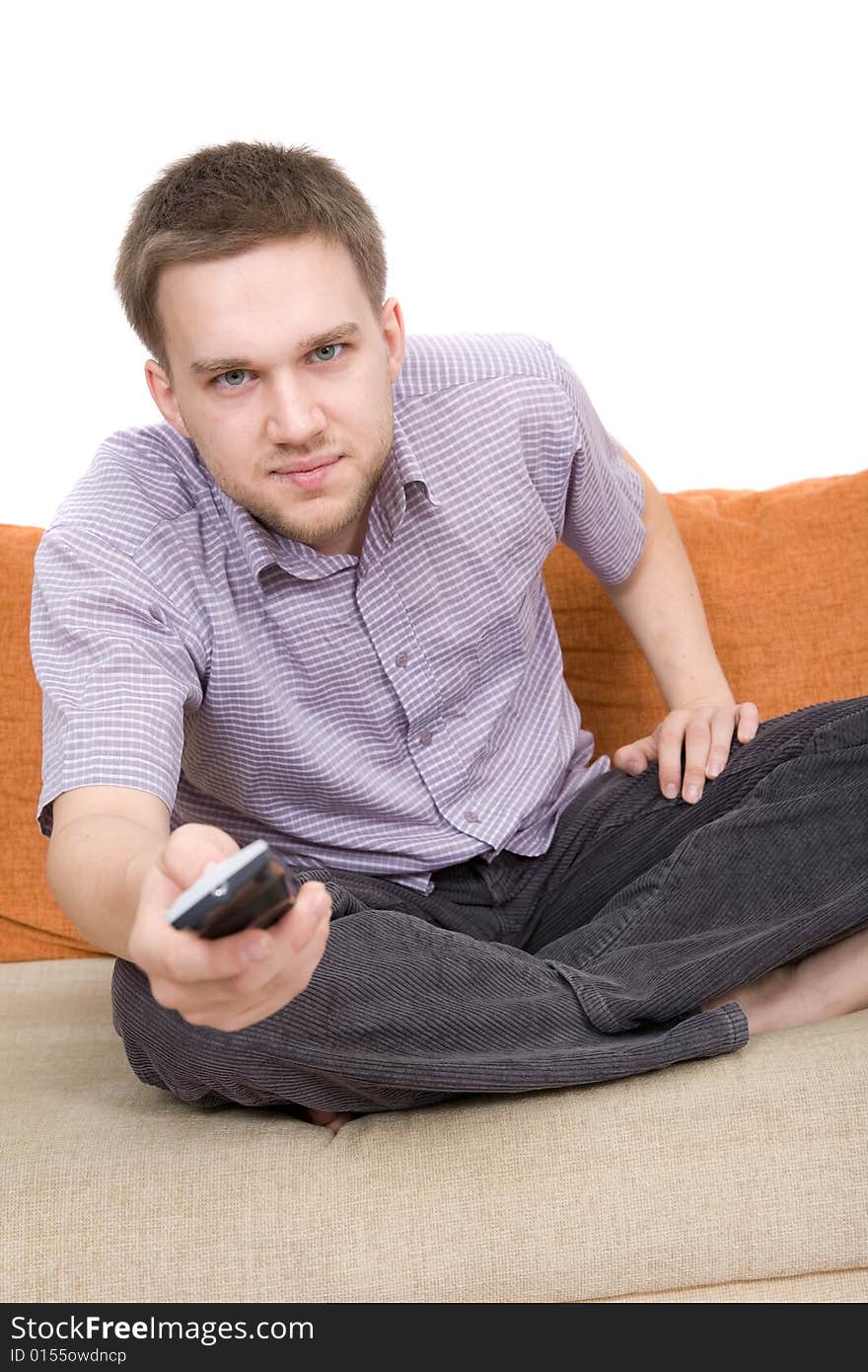 Casual man sitting on sofa with remote control. Casual man sitting on sofa with remote control