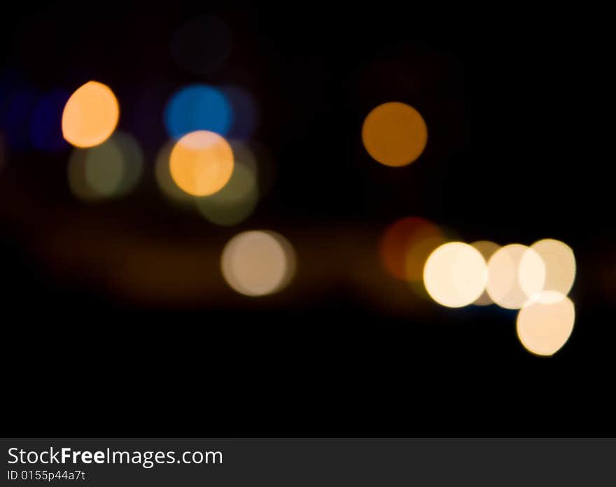 Blurred and defocused lights in night city. Blurred and defocused lights in night city