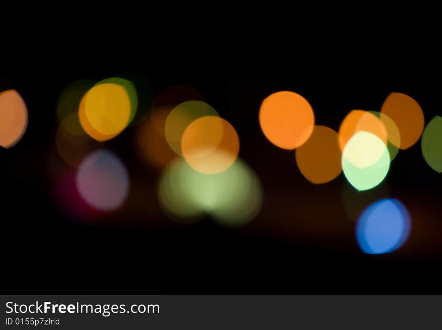 Blurred and defocused lights in night city. Blurred and defocused lights in night city