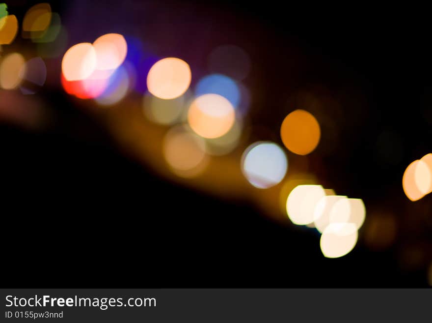 Blurred and defocused lights in night city. Blurred and defocused lights in night city