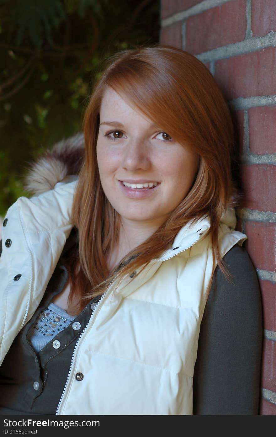 Girl with White Vest Poses for Camera