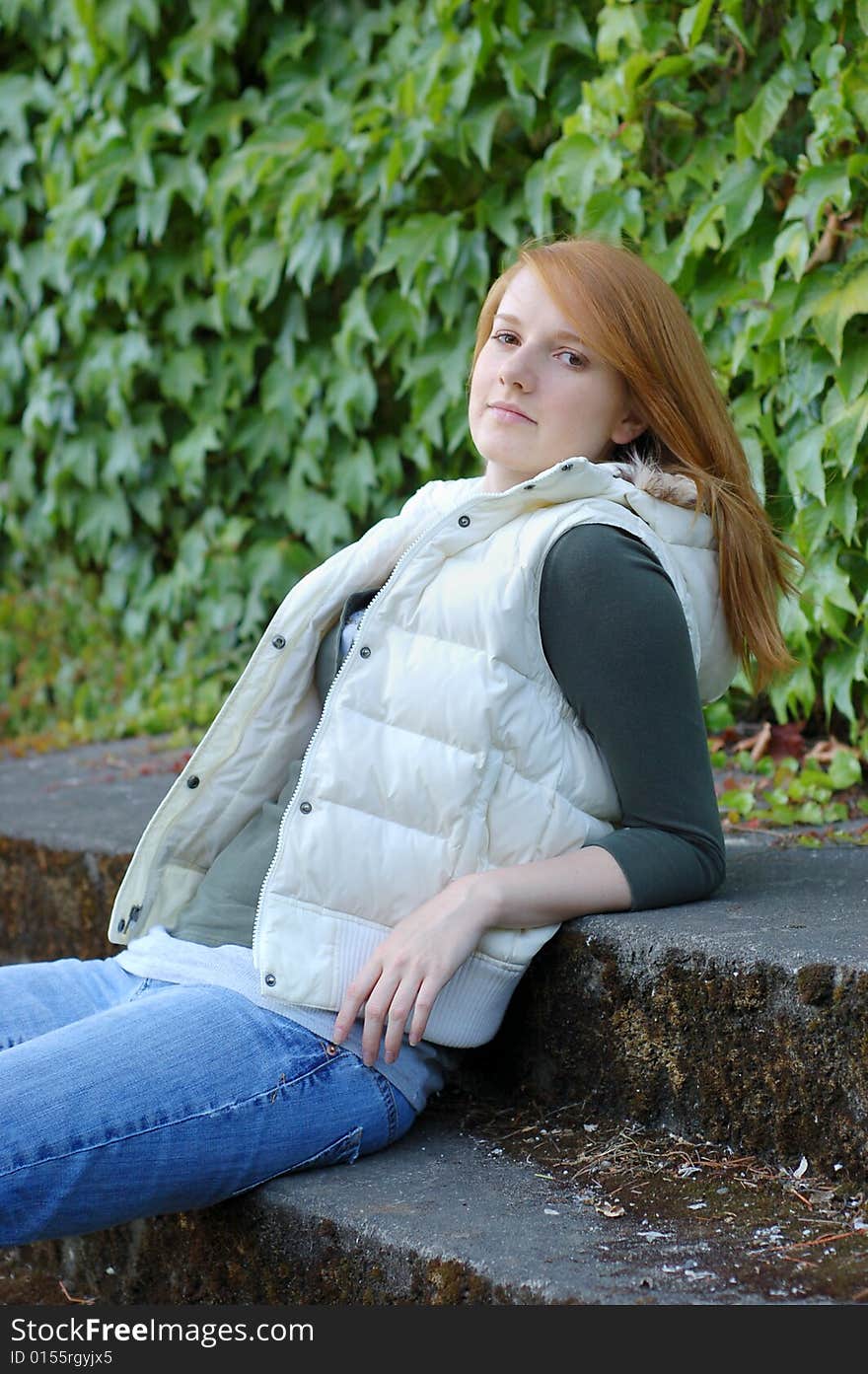 Girl with White Vest Poses for Camera