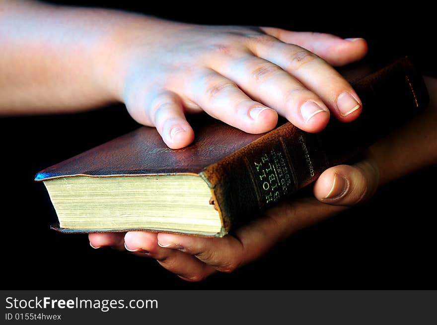 A view with hands and bible during worship time