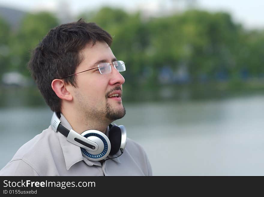 Young smiling man with headphones