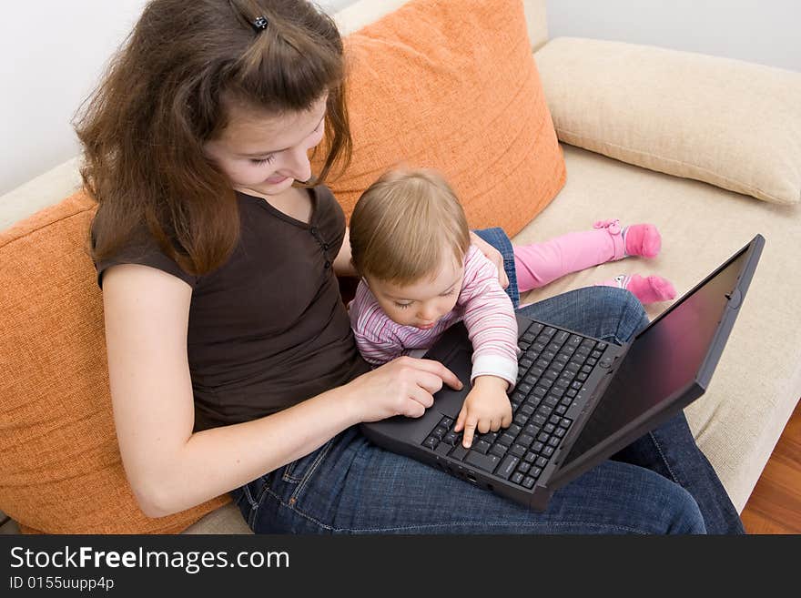 Happy family together on sofa with laptop. Happy family together on sofa with laptop