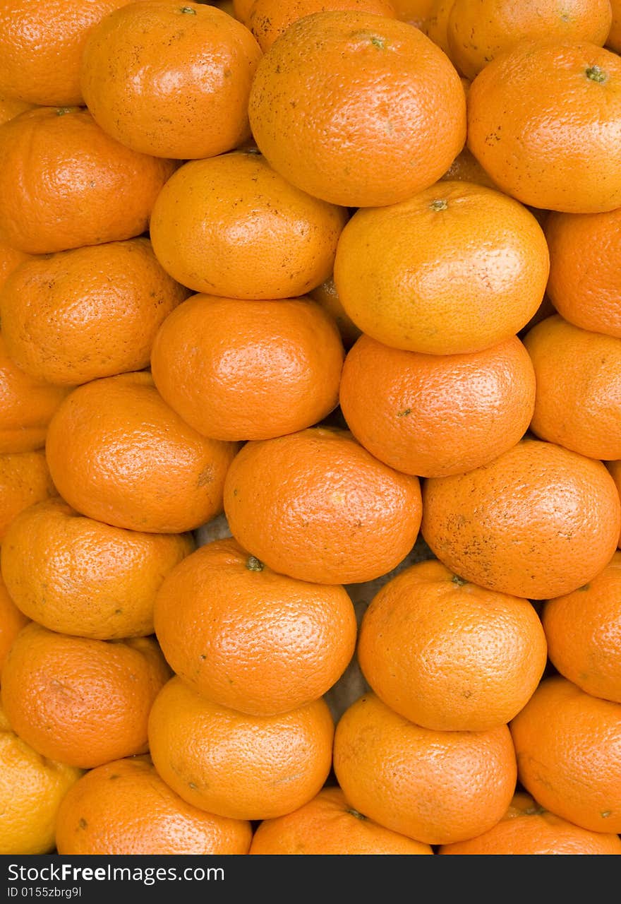 Close up of a lot of tangerines.