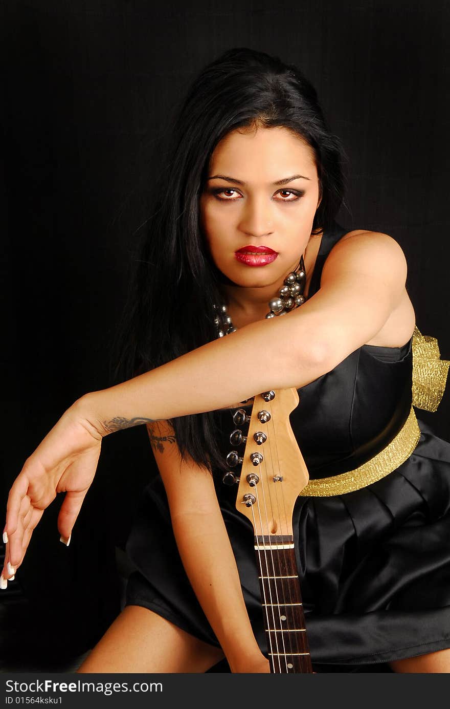 Latino Woman With Guitar