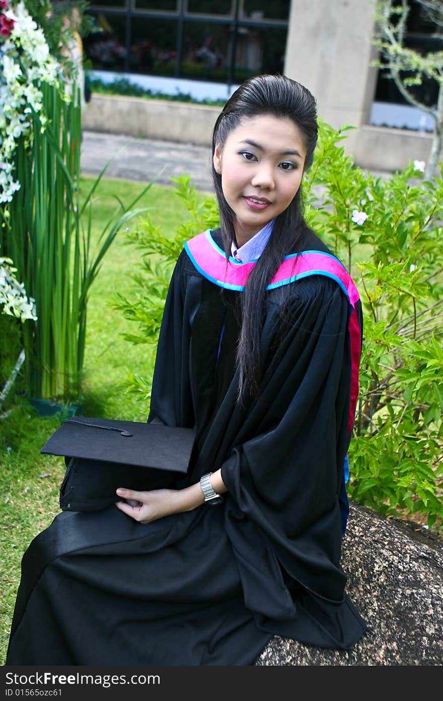 Beautiful Asian university graduates celebrate their success.