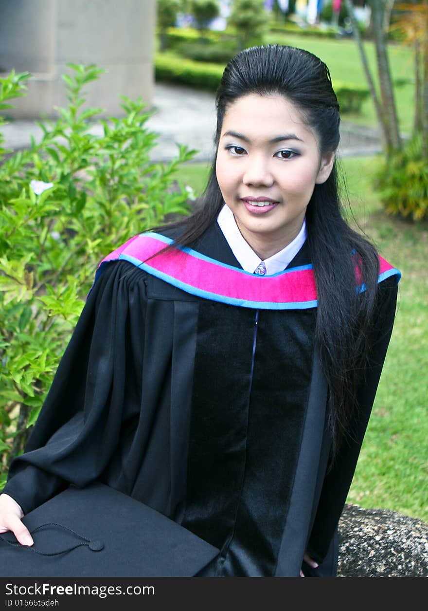 Beautiful Asian university graduates celebrate their success.