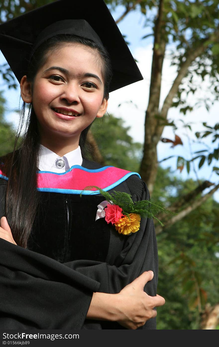 Beautiful Asian university graduates celebrate their success.