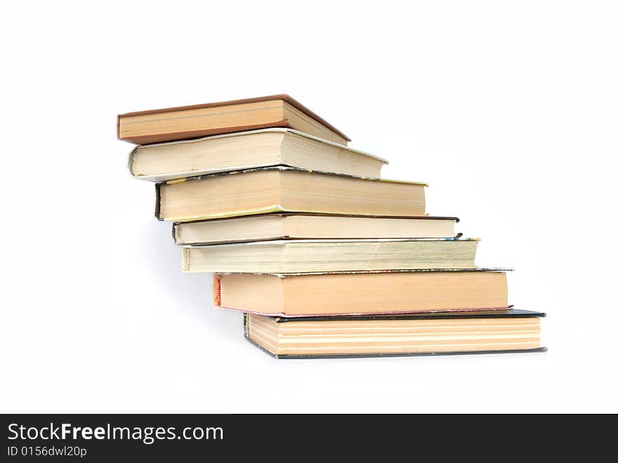 Pile of books on a grey background