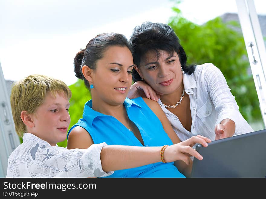 Portrait of happy family getting busy with laptop. Portrait of happy family getting busy with laptop