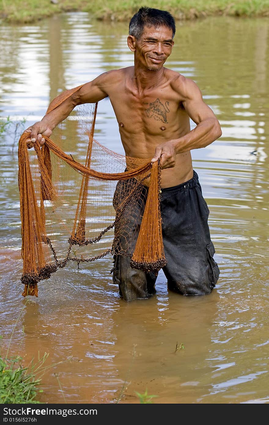 Fisherman of Thailand with throw net