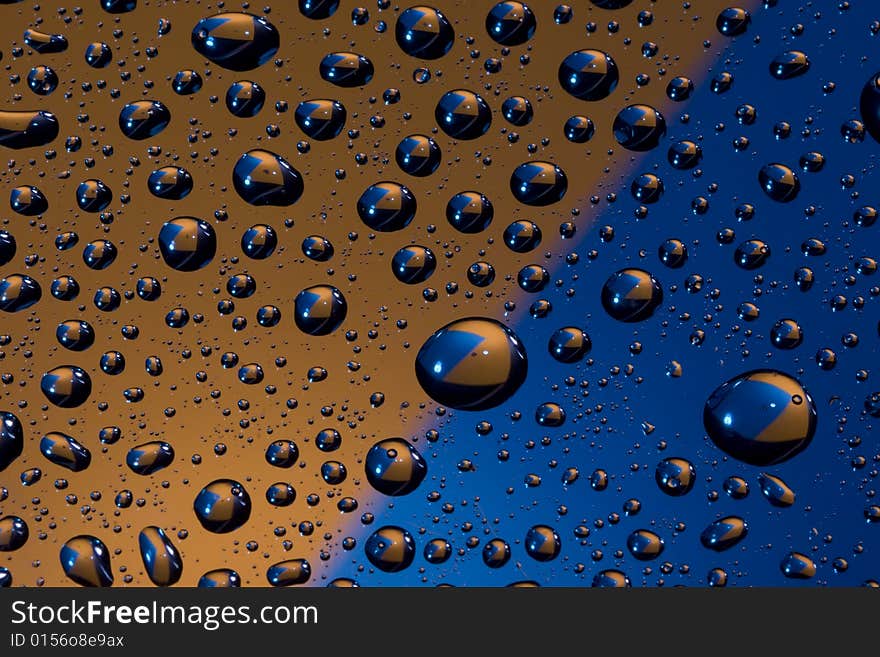 Water drops on orange and blue.