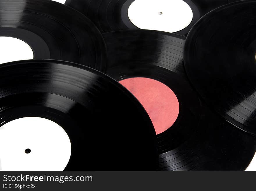 Background of vinyl records with red and white labels