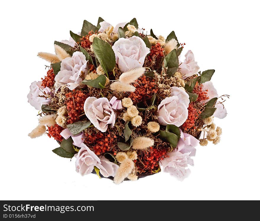 Decorative traditional wick basket with fake flowers in it. Decorative traditional wick basket with fake flowers in it