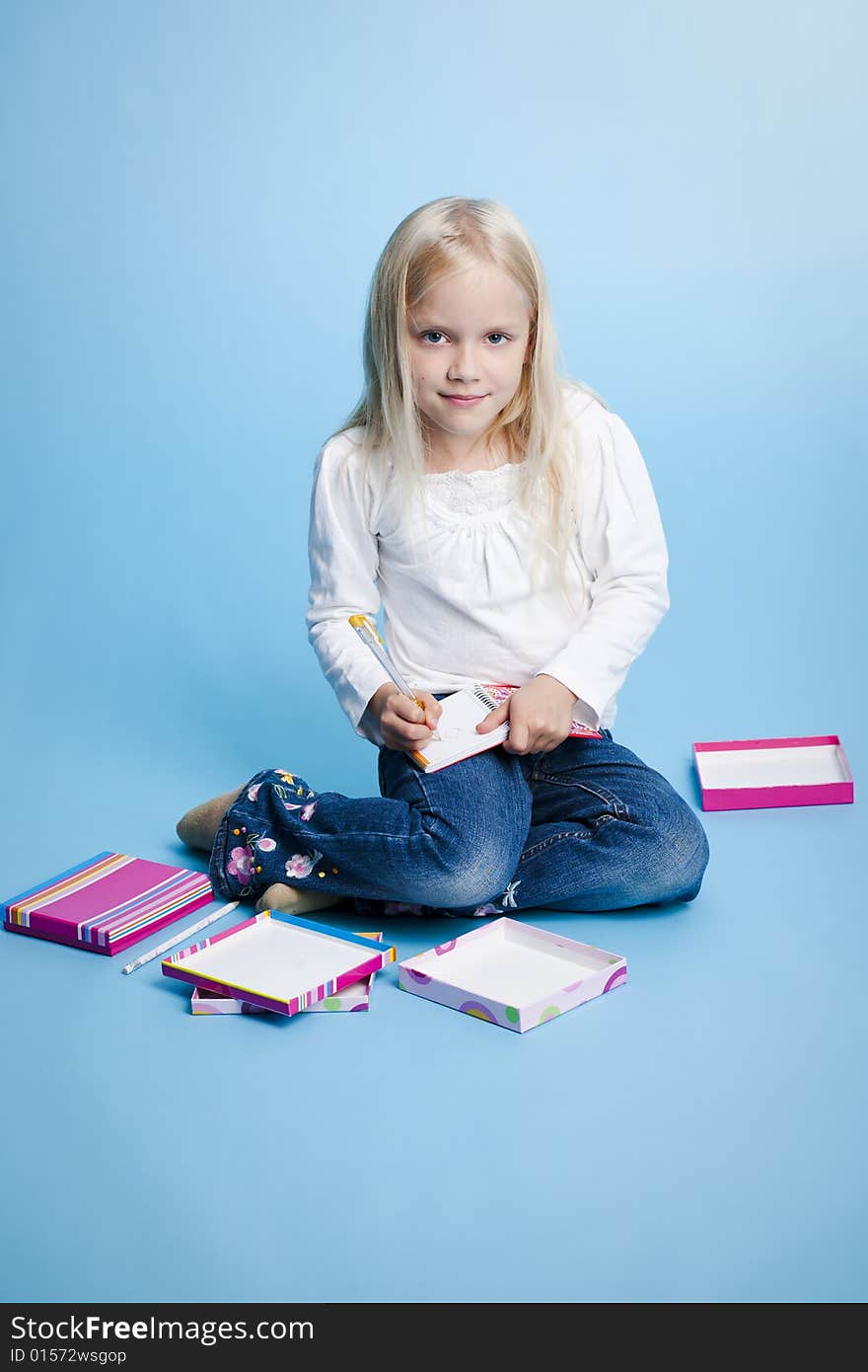 Girl writing something on her notebook