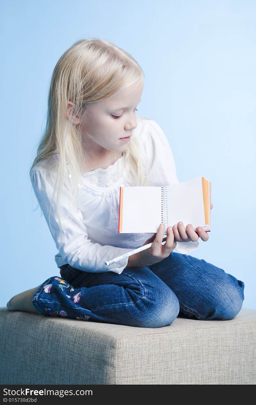 Girl showing a book